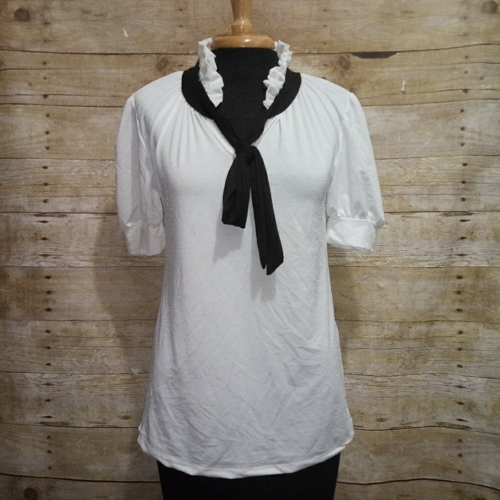 Emily Stacy White top with a black neck tie